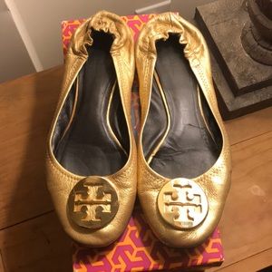 Well worn Gold Tory Burch Reva flat